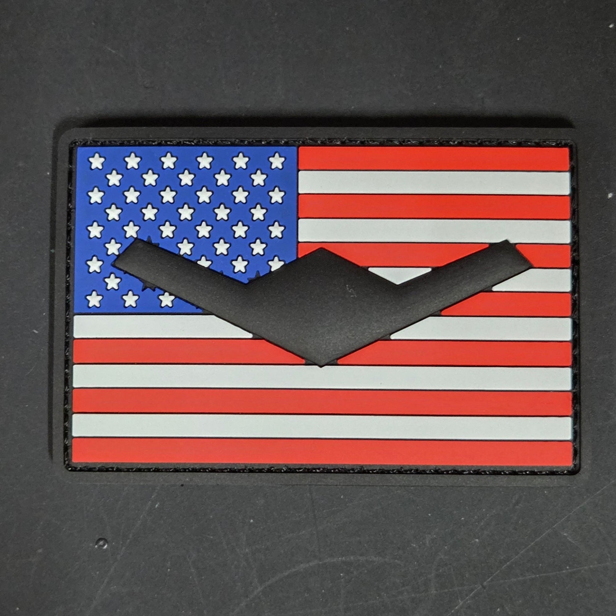 American flag patch with a B-21 on a dark background