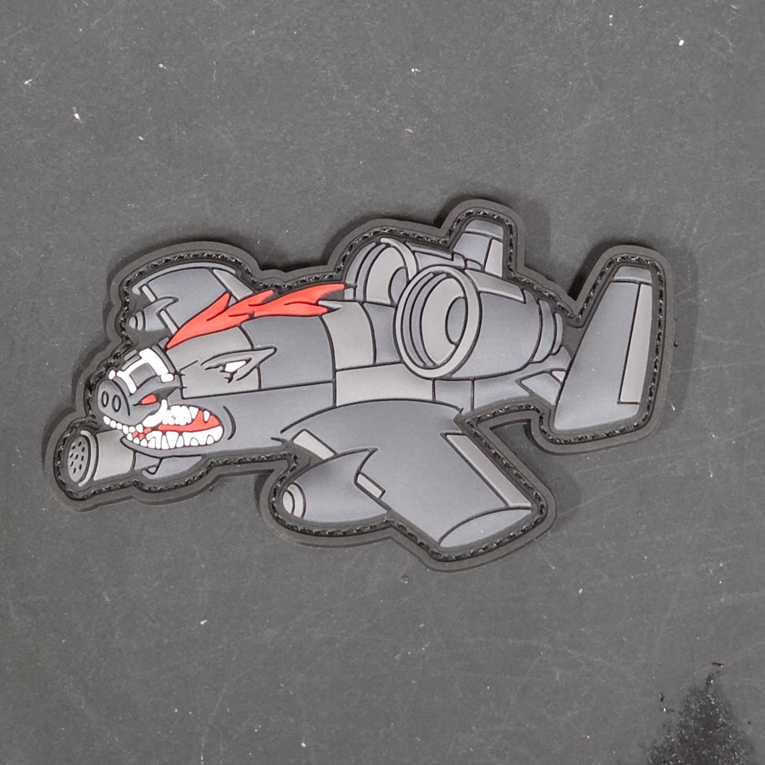 Cartoon image of an A-10 and Warthog gray patch