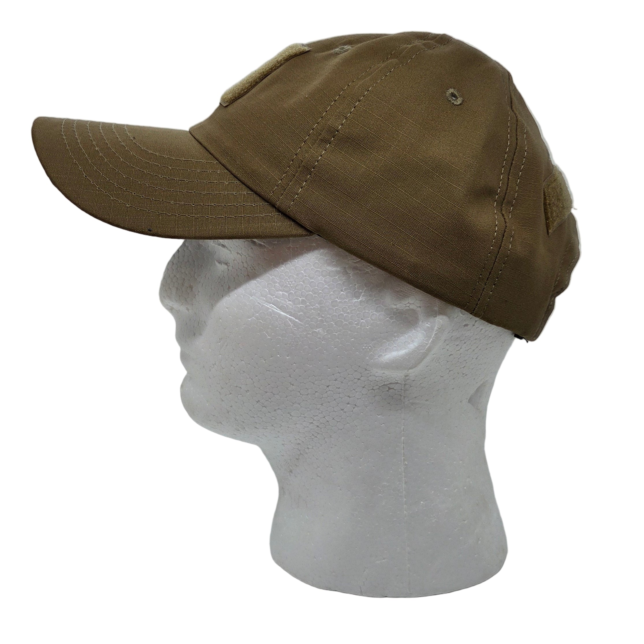 Brown cap on a mannequin head in a white display box