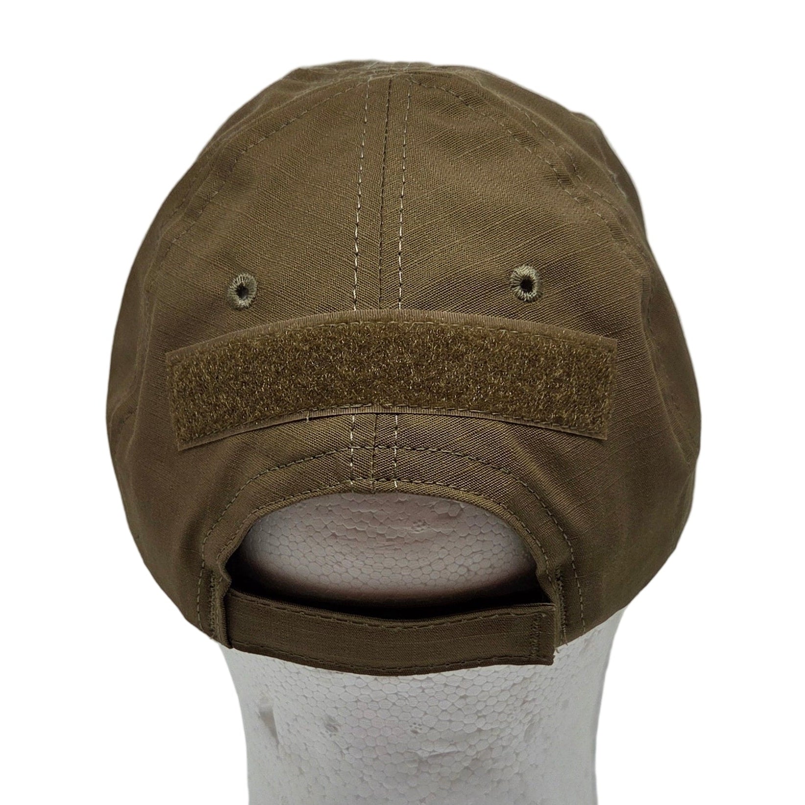 Brown cap inside a white box with a light source